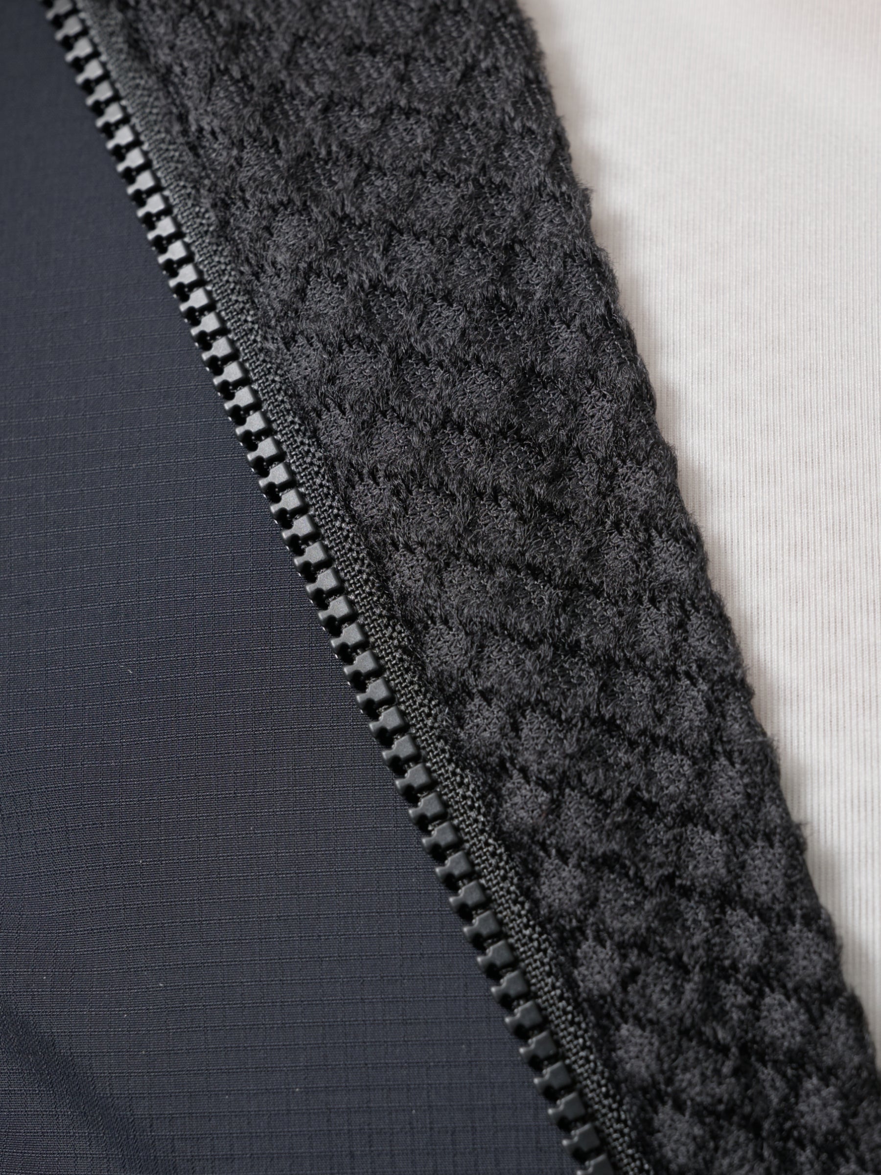Team Flow+ Vest in Green Slate: Enhanced warmth on the front and shoulders with strategically placed lightweight Teijin Octa®