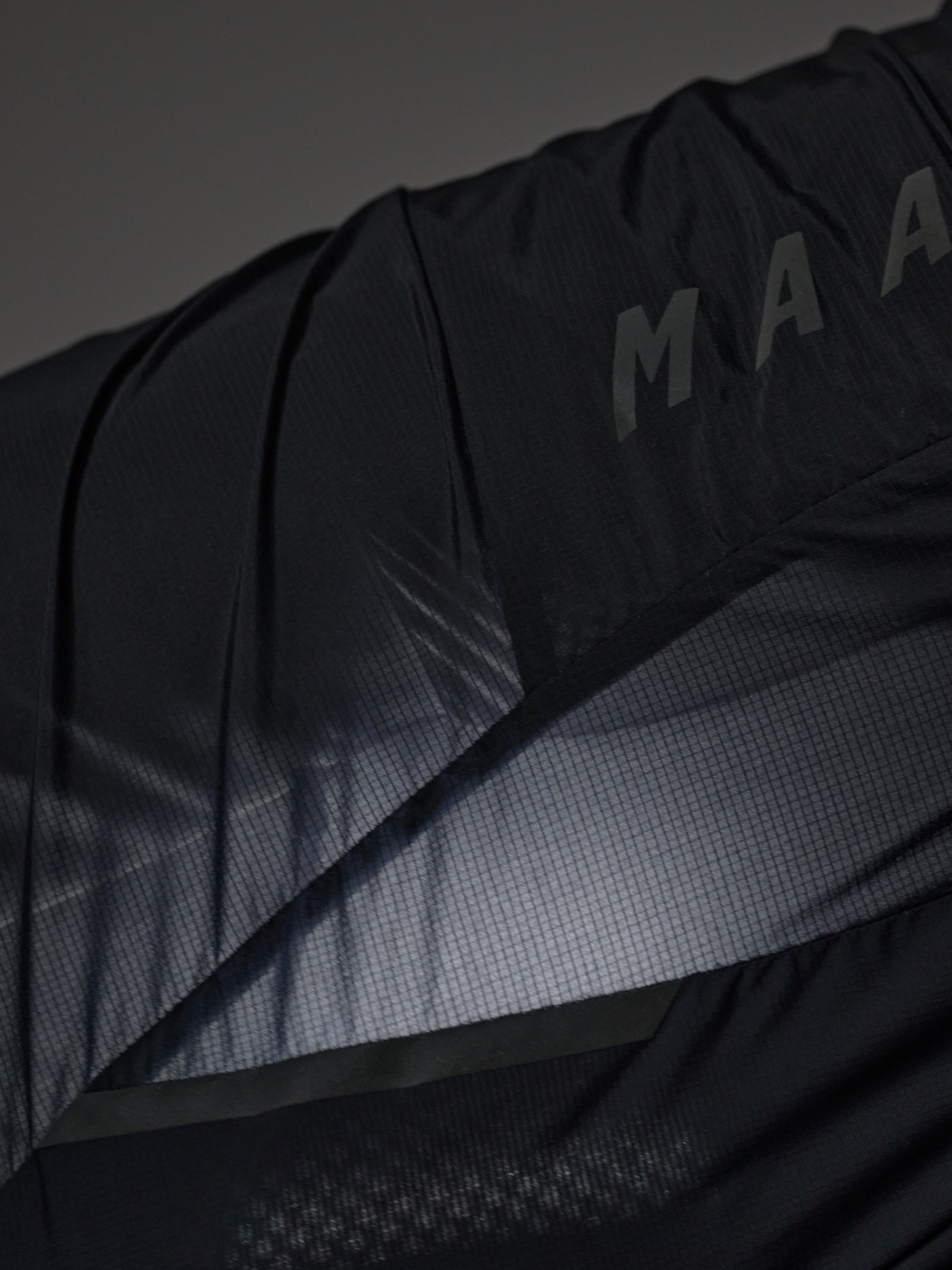 Team Flow+ Vest in Green Slate: Wind-blocking ripstop materials provide protection where you need it most.
