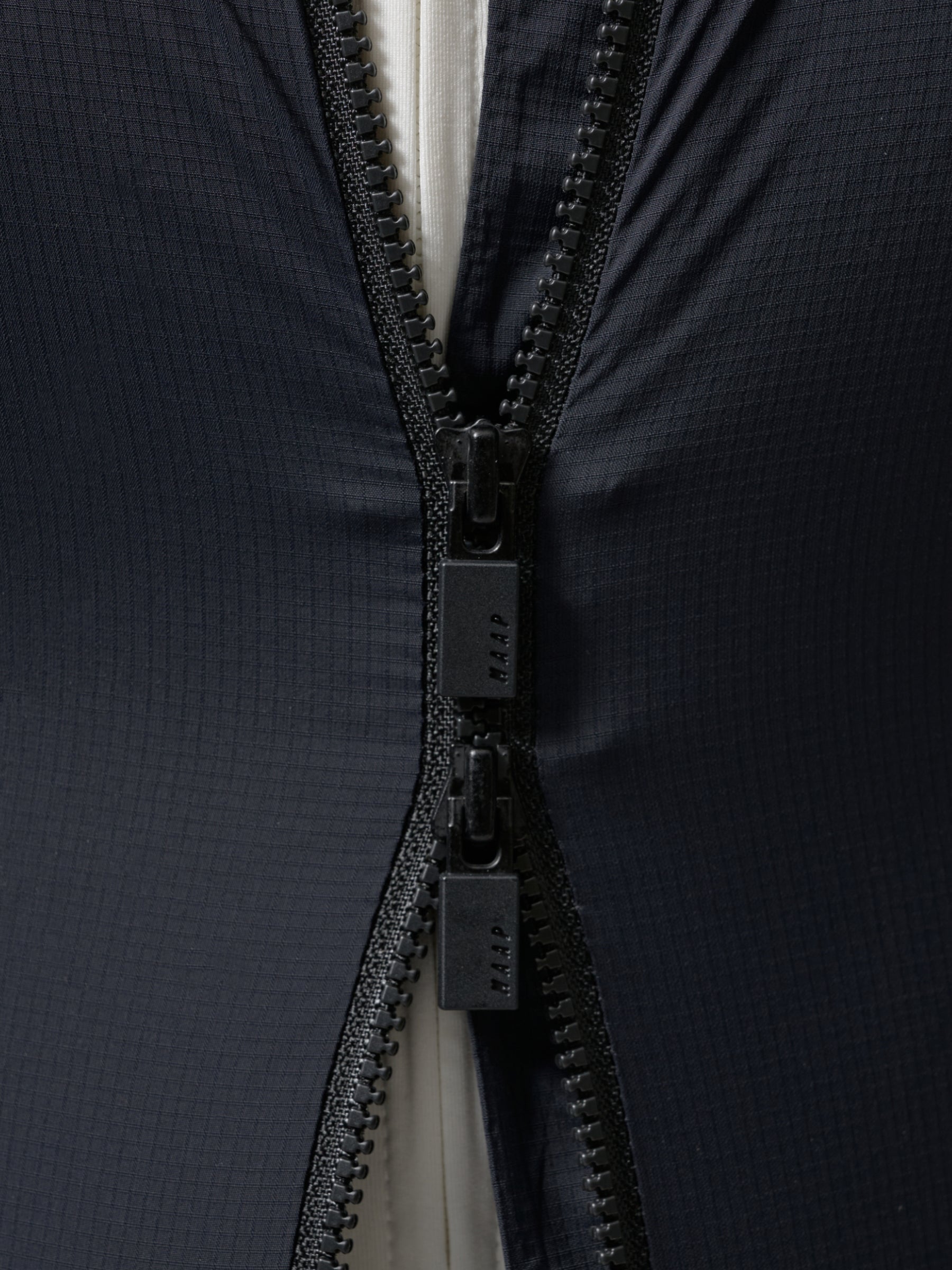 Team Flow+ Vest in Green Slate: Dial in your airflow needs and easily access your pockets with the 2-way YKK zip with camlock
