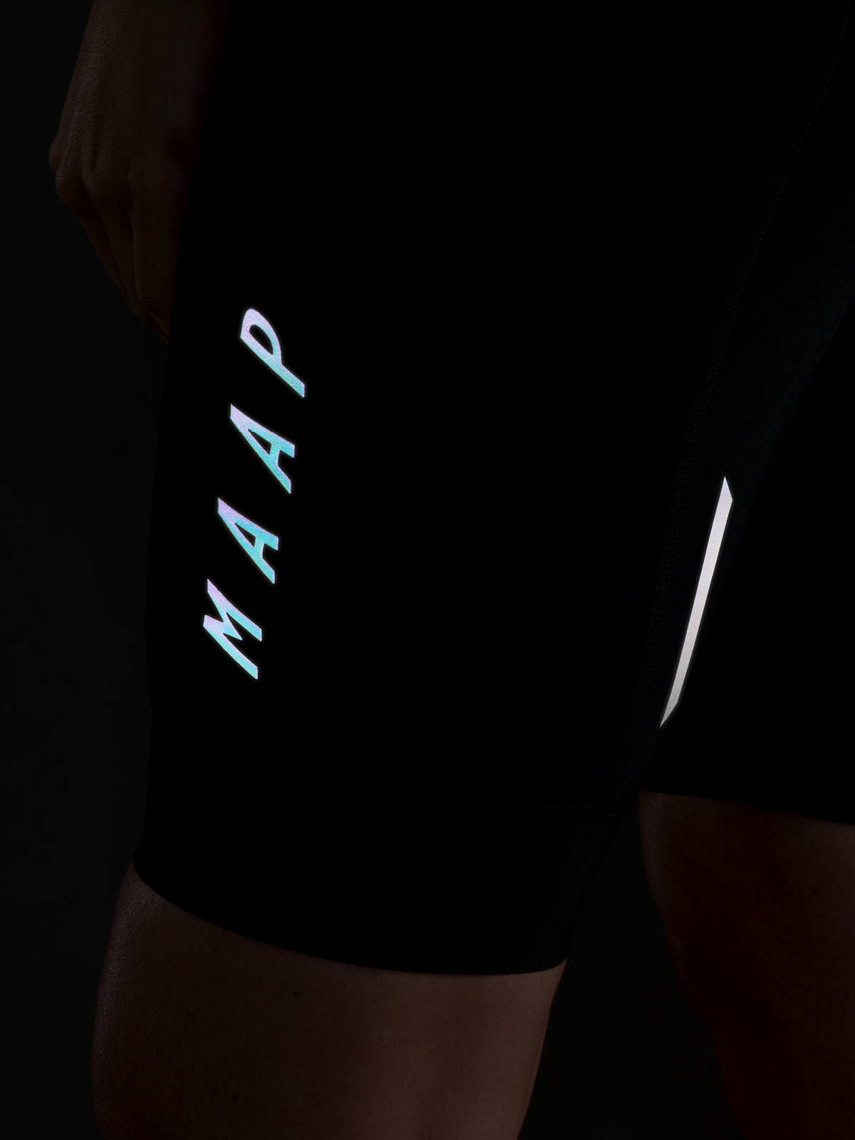 Women's Team Bib Evo in Warm Iron: Ensuring the leg hem stays firmly in place with an elasticated hem band with a silicone gr