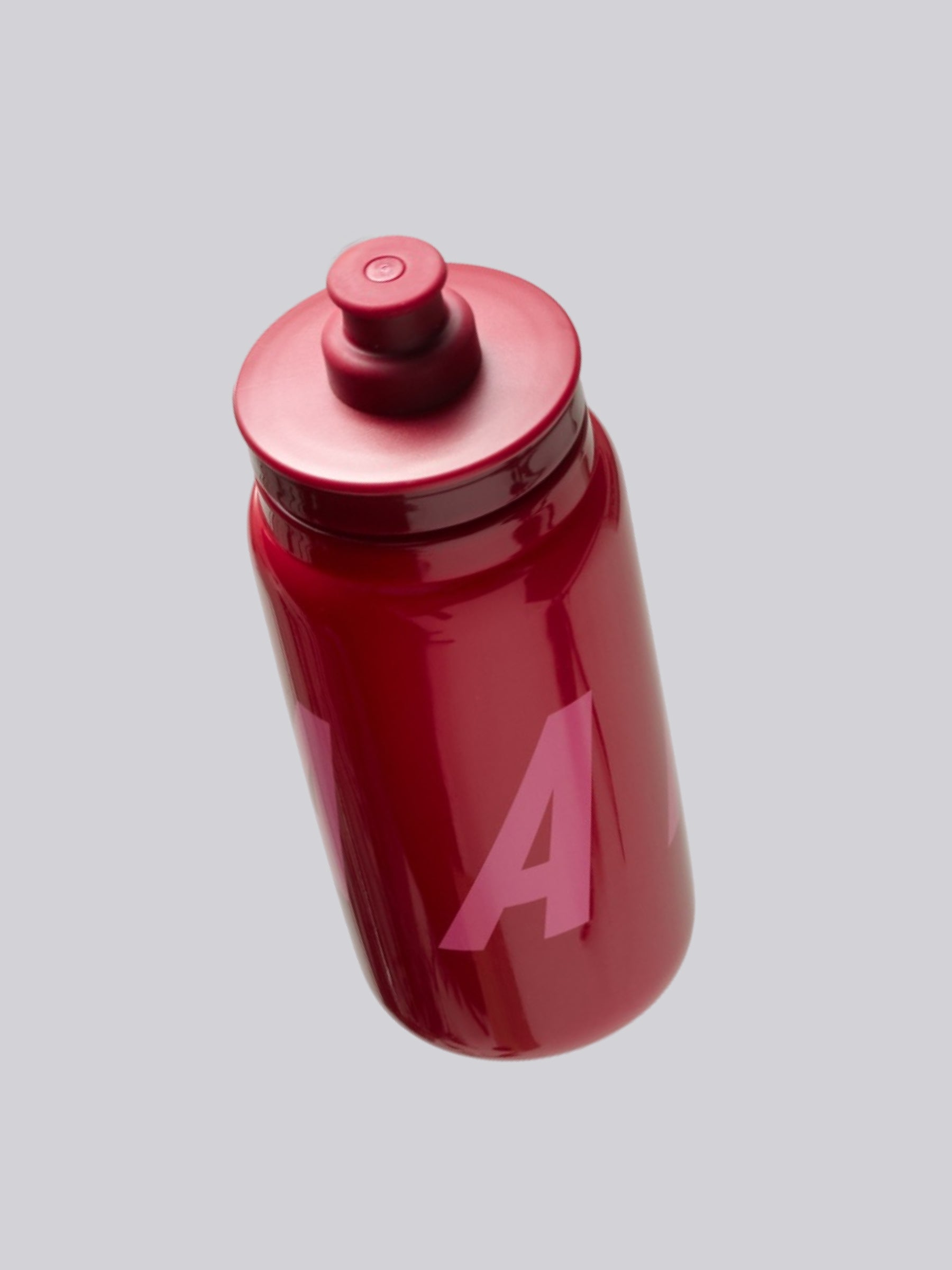 MAAP Bottle in Amaranth: Large screw top design is leak-free and wide enough for ice cubes and scooping in powdered drink mix