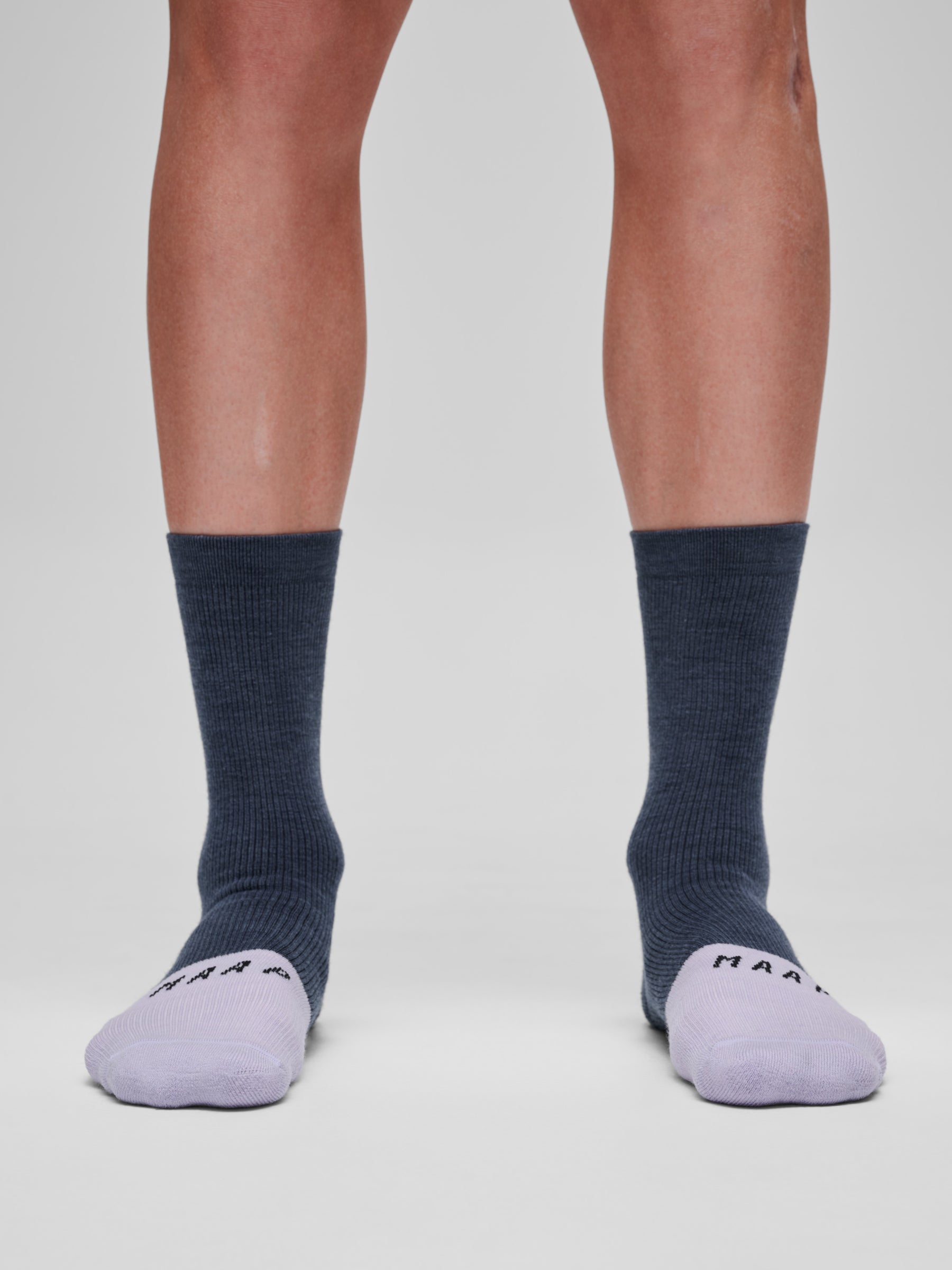Team Merino Sock in Carbon Blue/Thistle: Crafted with a Premium Merino wool blend that is thermoregulating, moisture-wicking