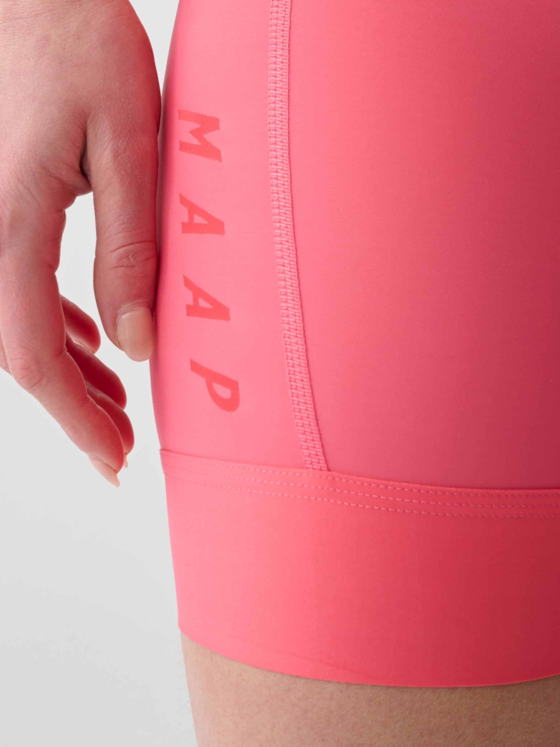 WOMEN'S SHORT TEAM BIB EVO - VIVID PINK