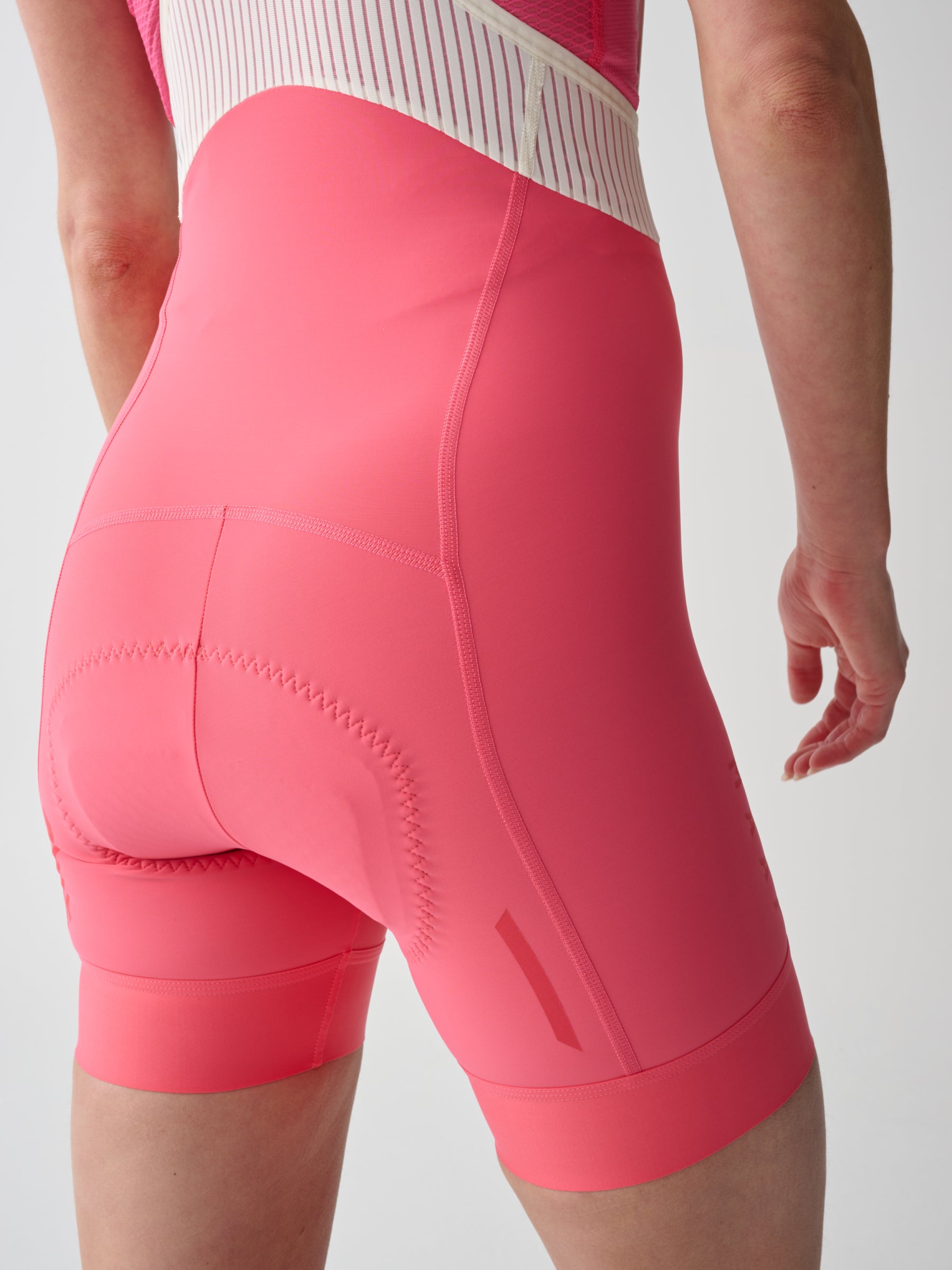 WOMEN'S SHORT TEAM BIB EVO - VIVID PINK