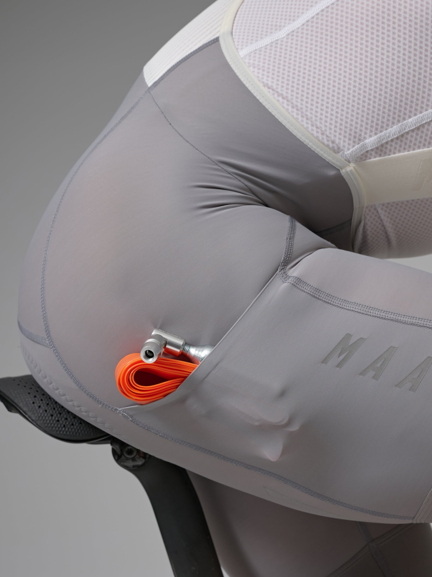 Team Bib Evo Cargo in Charcoal Plum: Additional on-the-go storage is seamlessly integrated with dual-sided cargo pockets on o