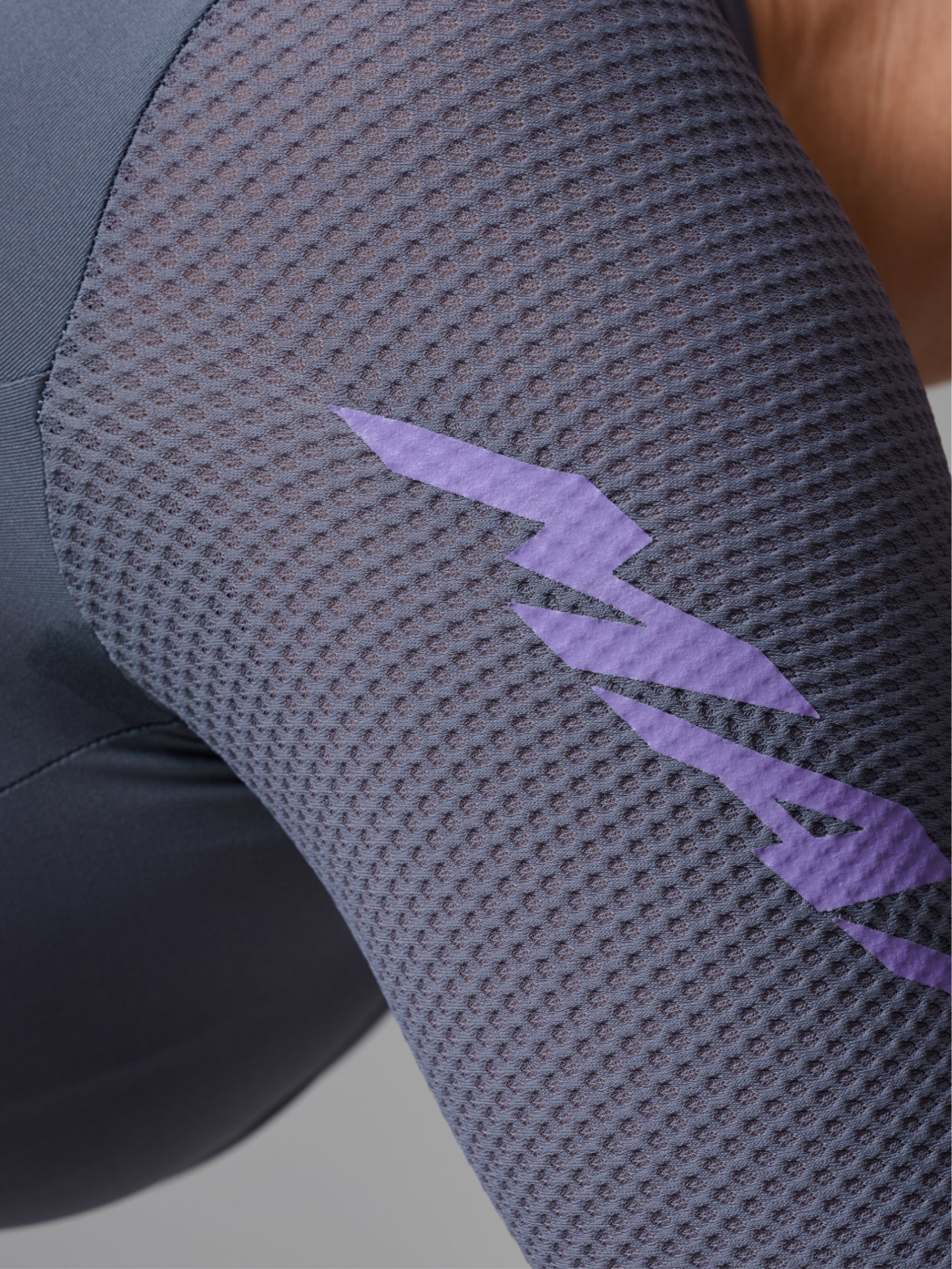 Women's Pro Emerge Jersey in Crater: Advanced breathability achieved through premium recycled honeycomb mesh sleeves.
