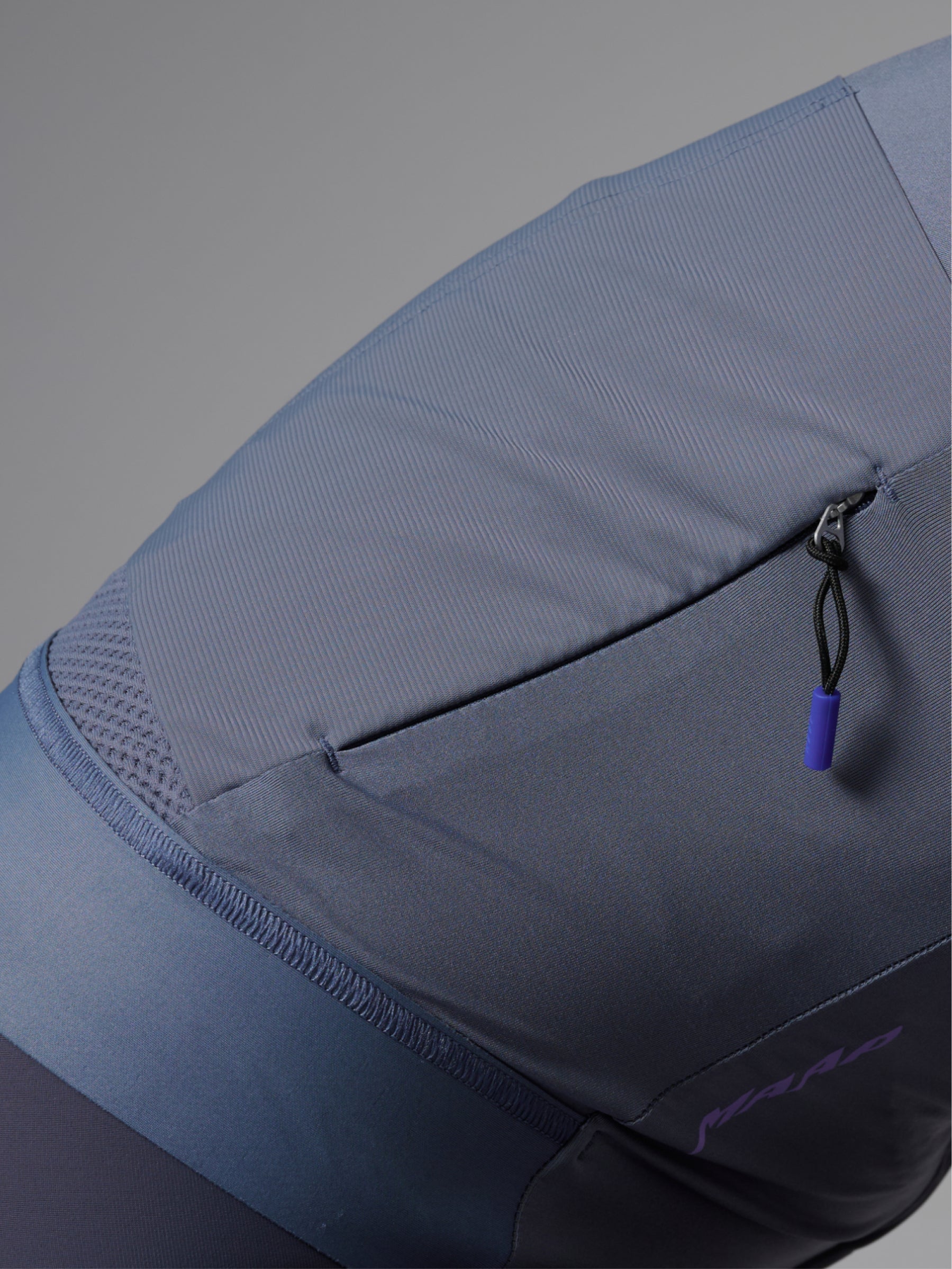Women's Pro Emerge LS Jersey in Crater: Additional storage with a sleek and secure low-profile internal rear zip pocket.